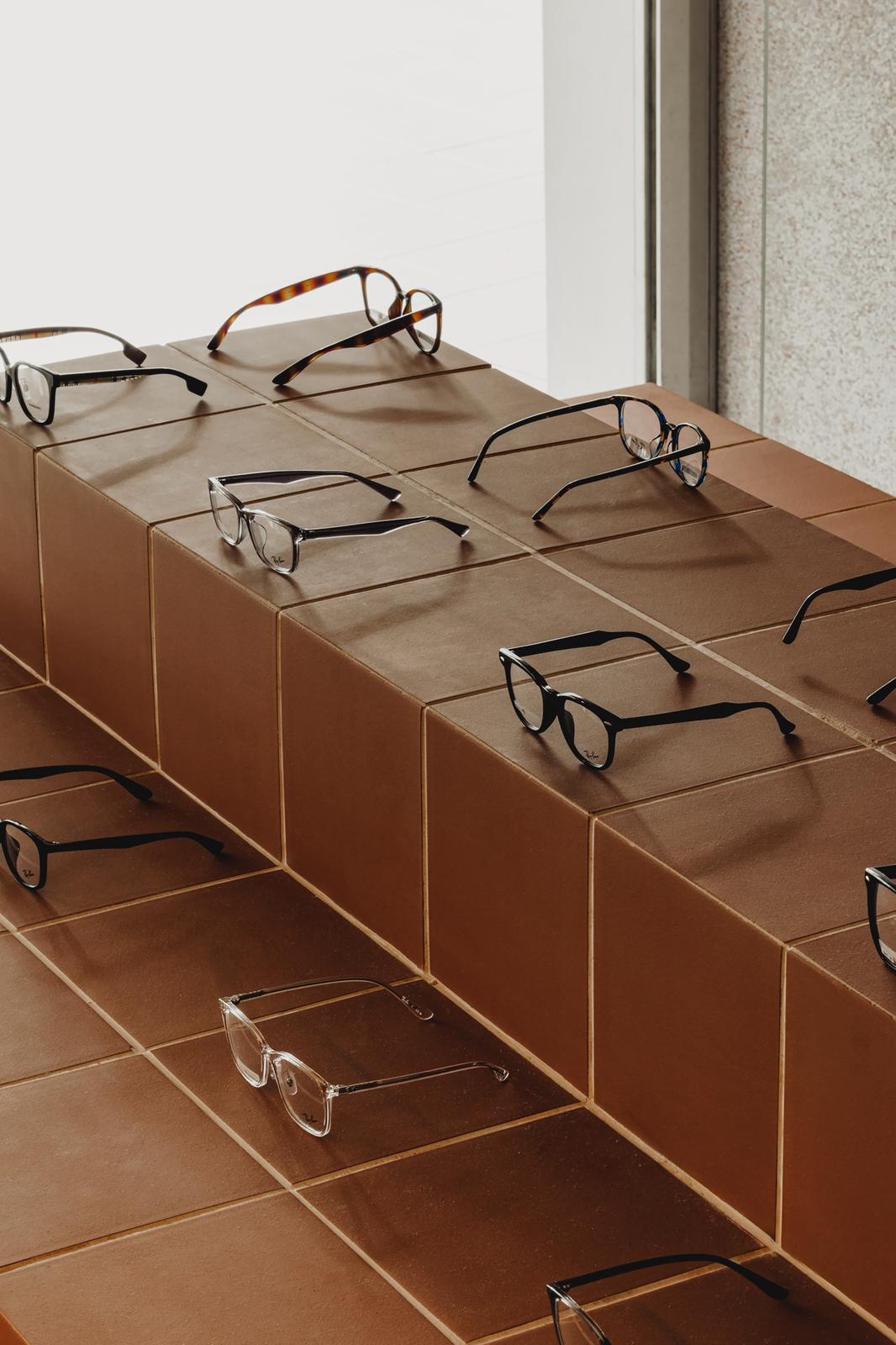 Designer eyewear displayed on the frame island at Eyecandy Optical